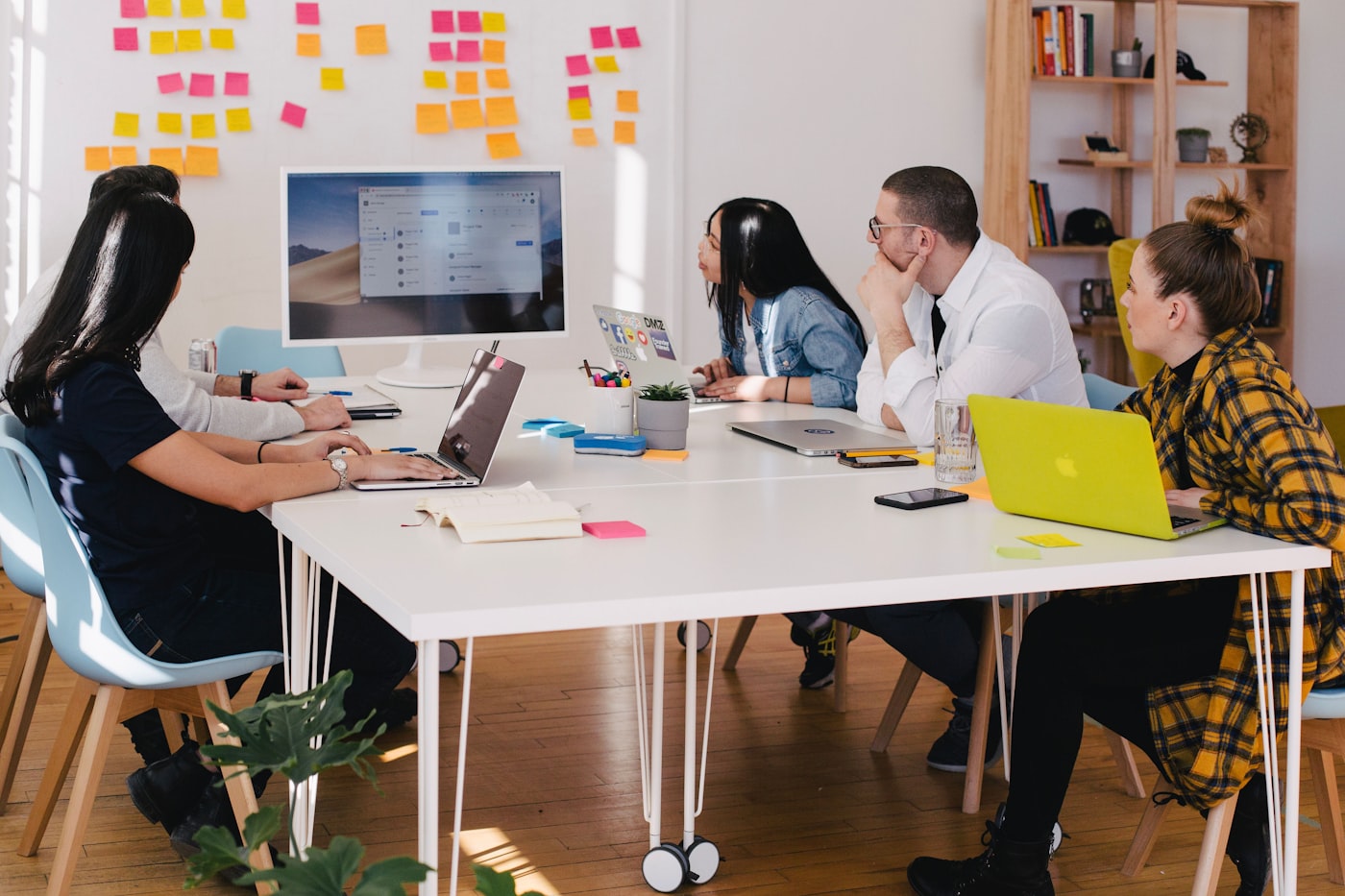 A whiteboard with a dependency map showing the founder at the centre of every business function — and the systems that replace that